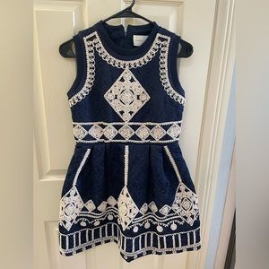 Elegant navy blue mini dress with crocheted design